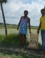 Farmer with MOP Bag at rice demo plot in Sundergama Vill Sitamarhi, Bihar, India